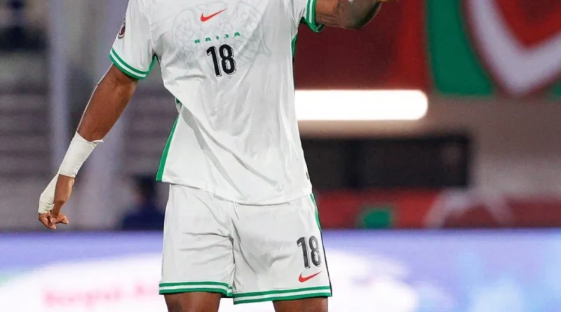 Football player in spotlight representing transfer move