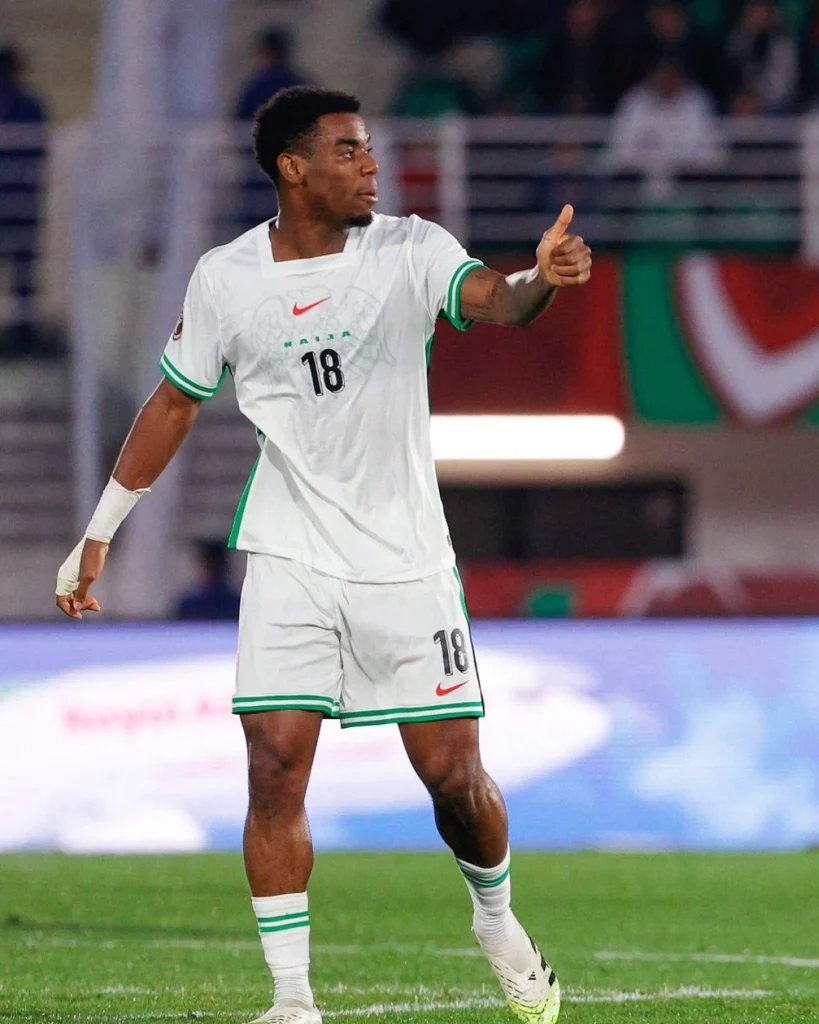 Football player in spotlight representing transfer move